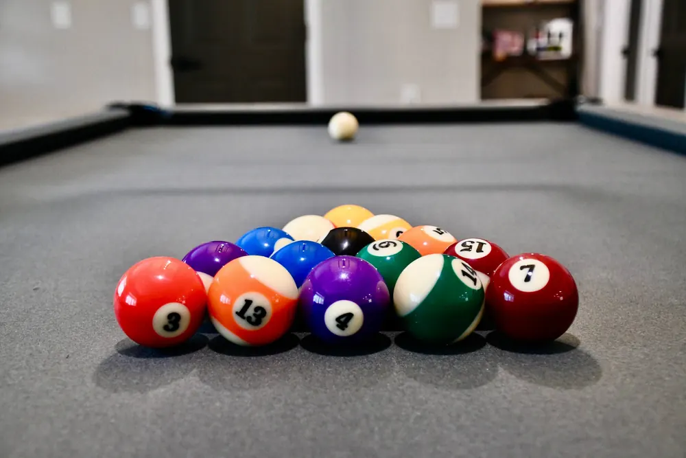 Racked billiard balls on the pool table